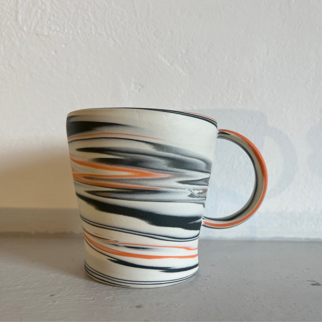 Polished Porcelain Cup With Orange And Blue/Grey Swirls
