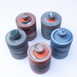 Polished Porcelain Lidded Vessel With Black, Orange and Pink Swirls