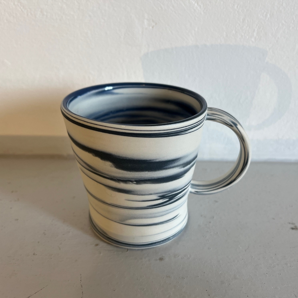 Polished Porcelain Cup With Blue And White Swirls