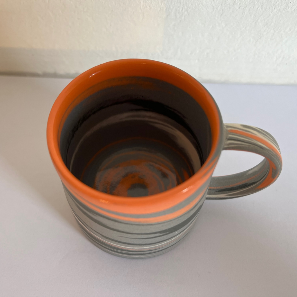 Polished Expresso Mug With Grey, orange And Black Swirls