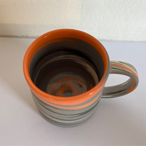 Polished Expresso Mug With Grey, orange And Black Swirls