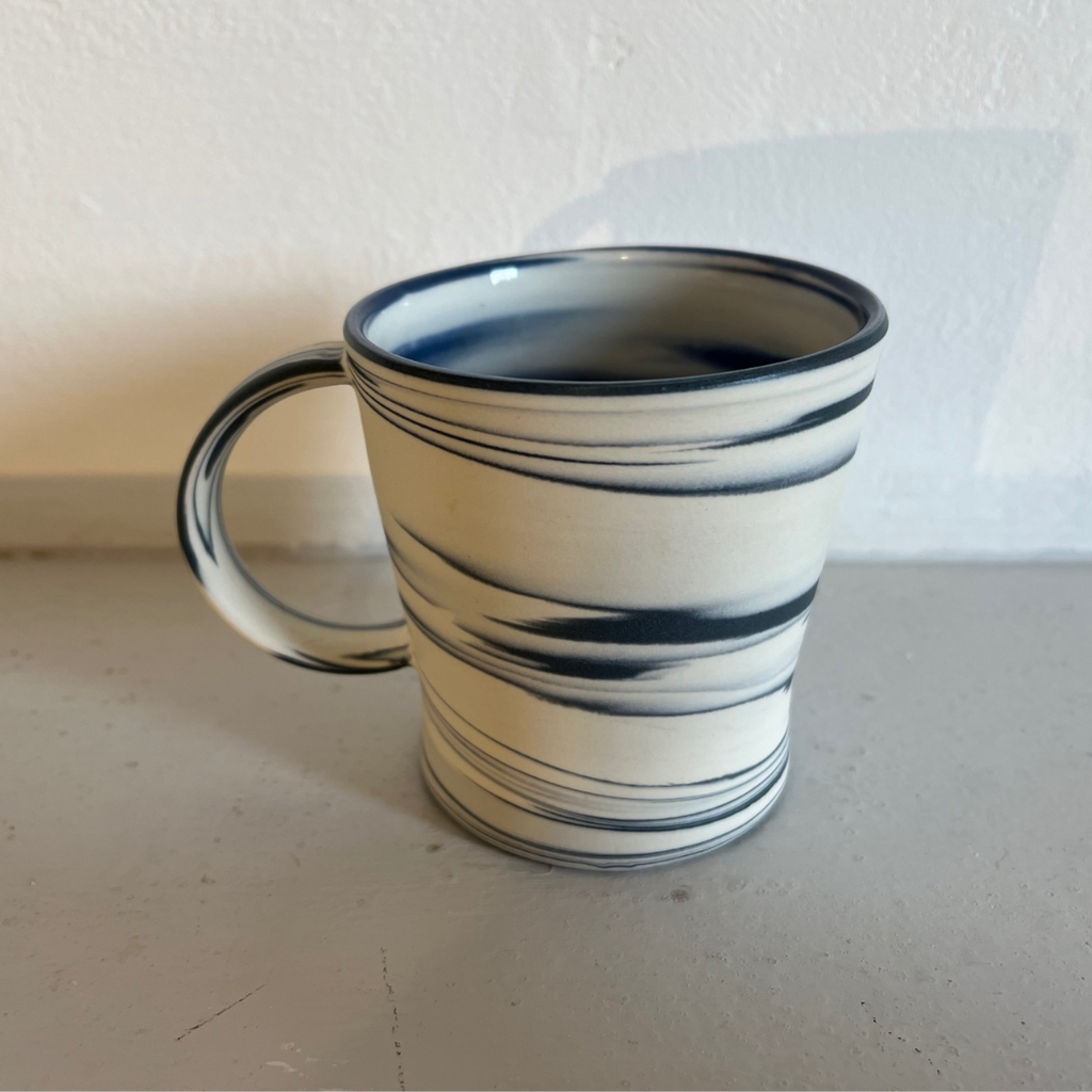 Polished Porcelain Cup With Blue And White Swirls